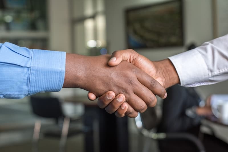 Professional handshake in an office setting